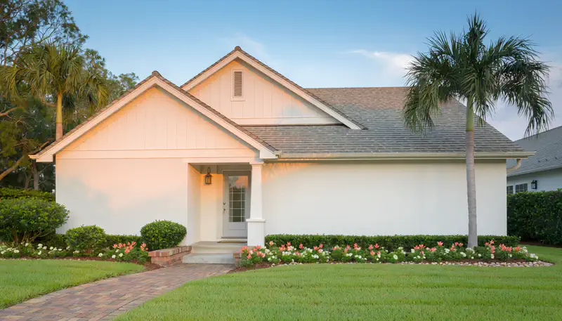 Completed new roof installation on a Florida home showing hip roof design